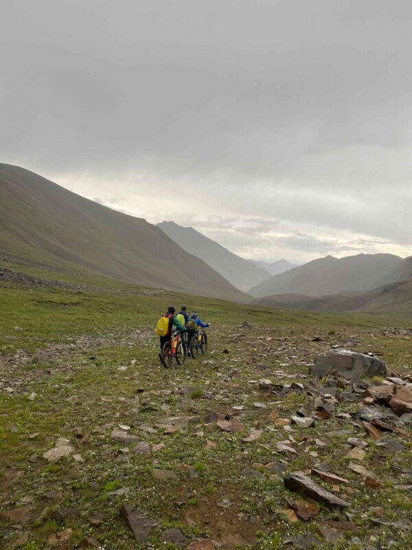 Riders resting at a mountain camp